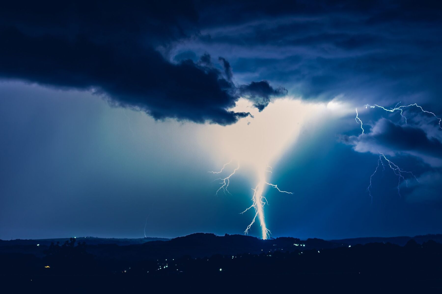 Calming Transformations Counseling - Night landscape on a background of thunderstorms telehealth therapy