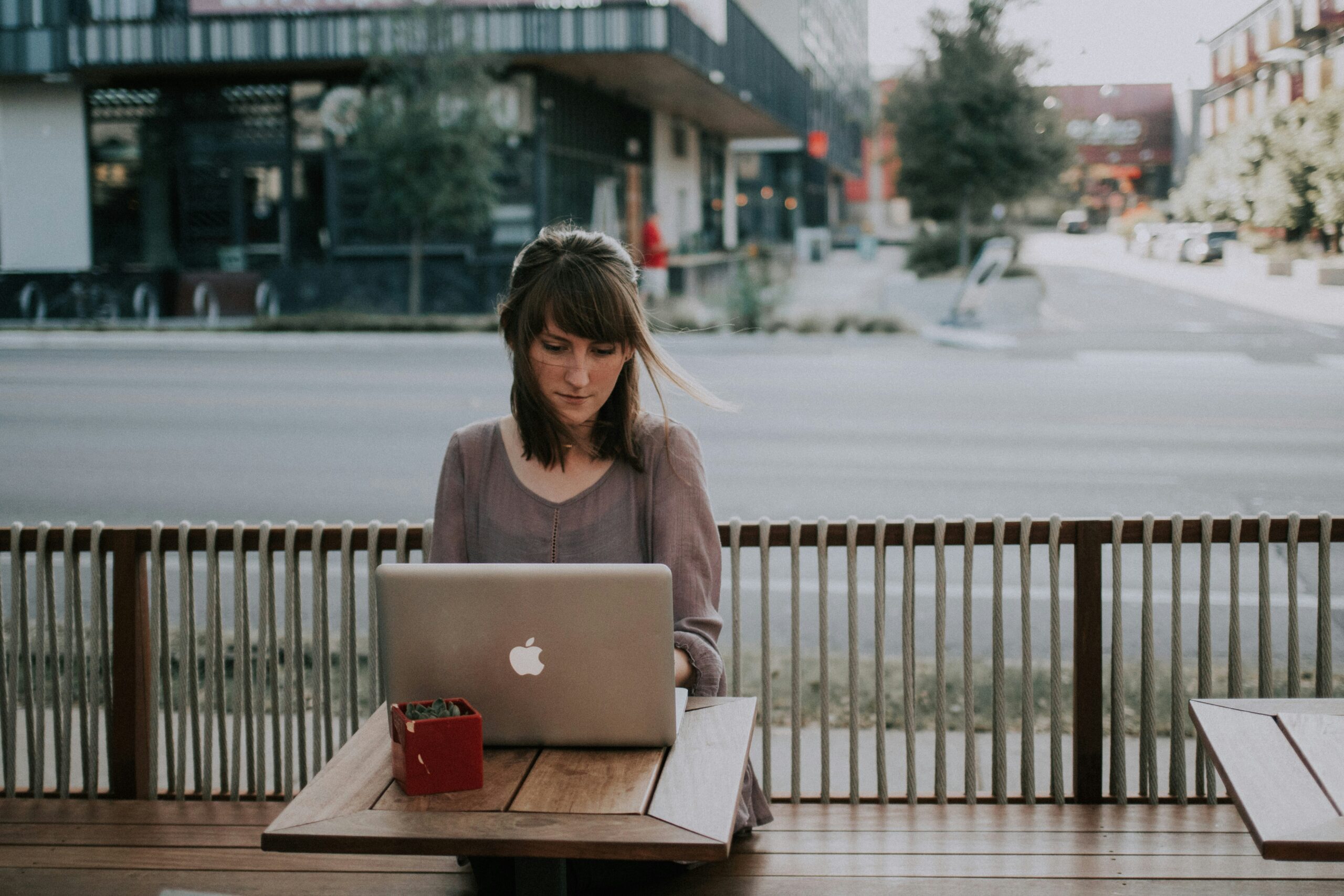 Calming Transformations Counseling - woman on her computer during online therapy session - online therapy