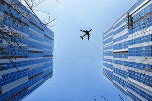 Airplane between buildings