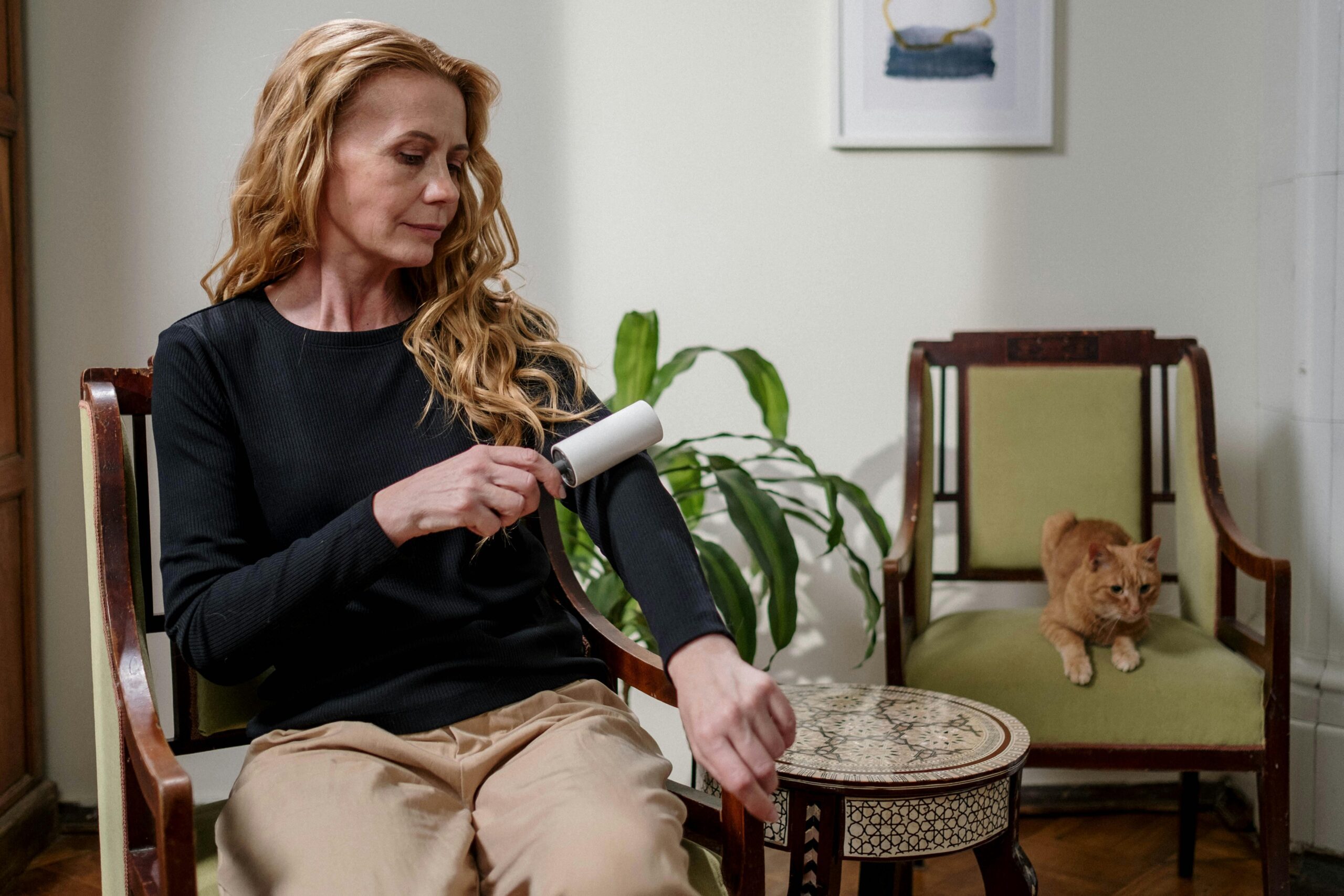 Woman cleaning cat hair