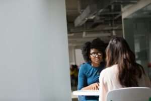 Therapist talking to patient