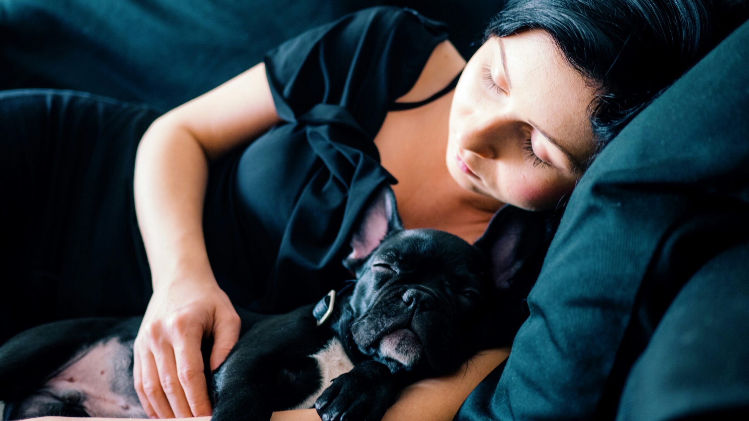 Woman and dog sleeping